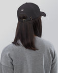 Unisex Classic baseball cap in dark gray with embroidered WHATEVR logo, front view