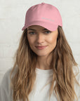 Unisex Classic baseball cap in pink with embroidered WHATEVR logo, front view