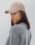 Unisex Classic baseball cap in beige with embroidered WHATEVR logo, front view