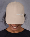 Unisex Classic baseball cap in beige with embroidered WHATEVR logo, front view