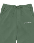 Men's essential relaxed sweatpants in green with embroidered detailing, front view.