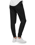 Men's essential slim fit sweatpants in black, side view.
