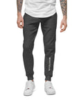 Men's essential slim fit sweatpants in graphite, front view.