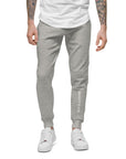 Men's essential slim fit sweatpants in heather grey, front view.