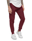 Men's essential slim fit sweatpants in maroon, front view.