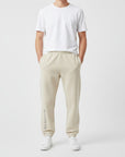 Men's premium heavyweight sweatpants in beige, front view.