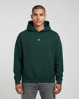 Men's premium heavyweight hoodie in green with "WR" logo, front view.