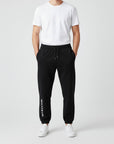 Men's heavyweight fleece sweatpants in black, front view.