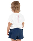 Toddler girl's t-shirt in white with "WHATEVR" text, back view.