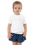 Toddler girl's t-shirt in white with "Nap Later" text, front view.