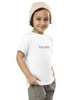 Toddler t-shirt in white with "Tiny Boss" text, front view.
