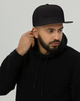 Unisex Tonal snapback hat in black with embroidered WHATEVR text, front view