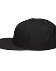 Unisex Tonal snapback hat in black with embroidered WHATEVR text, side view
