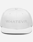 Unisex Tonal snapback hat in white with embroidered WHATEVR text, front view