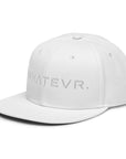 Unisex Tonal snapback hat in white with embroidered WHATEVR text, side view