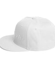 Unisex Tonal snapback hat in white with embroidered WHATEVR text, side view