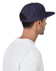 Unisex Unbothered snapback hat in blue with embroidered WHATEVR text, front view