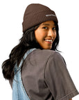 Unisex WHATEVR beanie in brown with embroidered detailing, front view