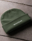 Unisex WHATEVR beanie in green with embroidered detailing, front view