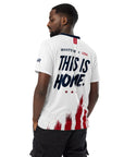 Man wearing a white t-shirt with 'THIS IS HOME' text and American flag design on a white background