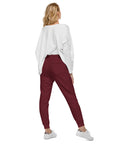 Women's essential slim fit sweatpants in maroon, back view.
