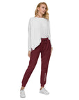 Women's essential slim fit sweatpants in maroon, front view.