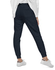 Women's essential slim fit sweatpants in dark blue, back view.