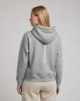 Women's premium heavyweight hoodie in ash heather with "WHATEVR" text, back view.
