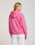 Women's premium heavyweight hoodie in pink with "WHATEVR" text, back view.