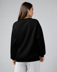 Women's premium crewneck sweatshirt in black with embroidered detailing, back view