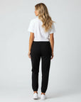 Women's heavyweight fleece sweatpants in black, back view.