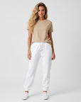 Women's heavyweight fleece sweatpants in white, front view.