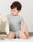 Baby short sleeve bodysuit in ash heather with "Play Hard Stay Comfy" text, front view.