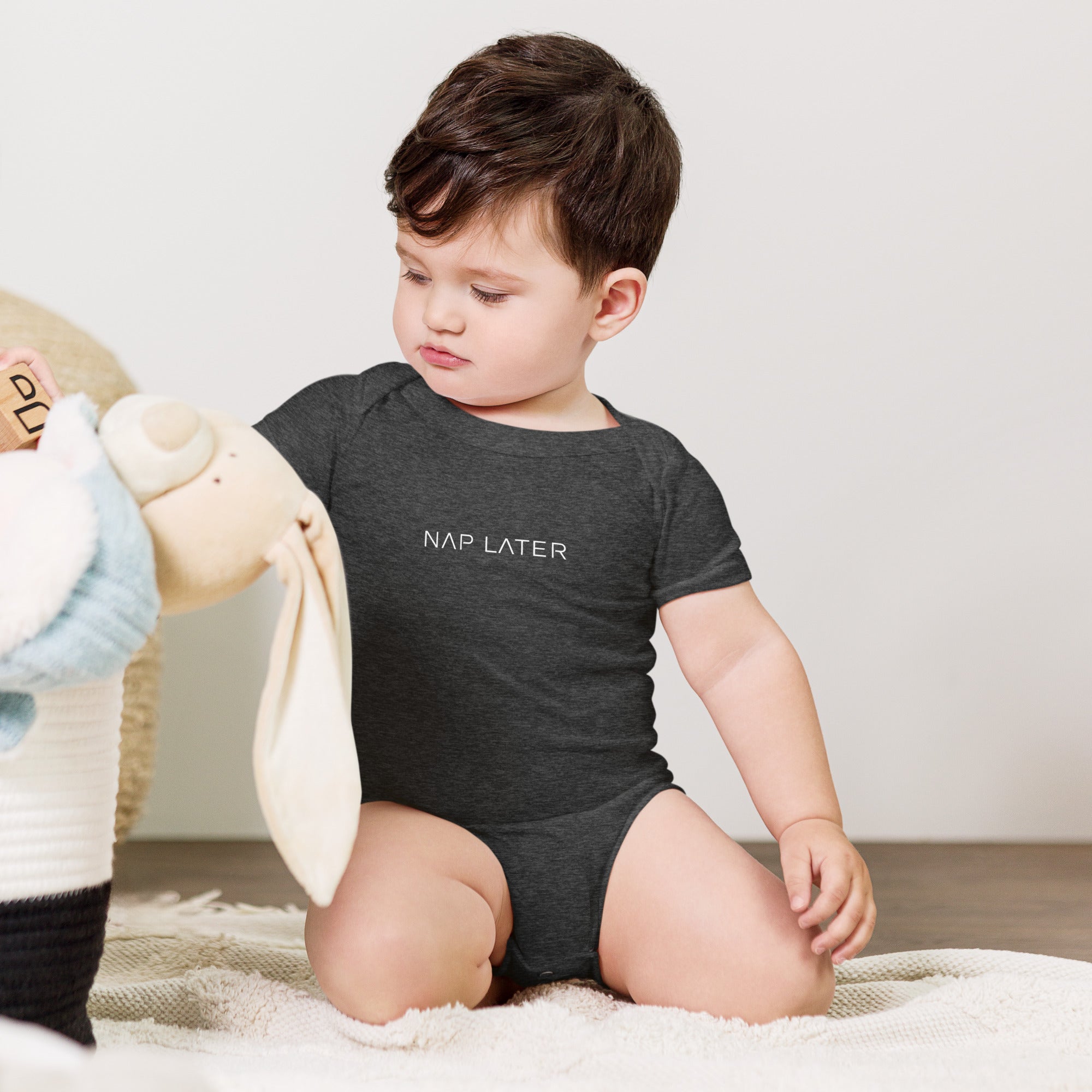 Baby short sleeve bodysuit in gray heather with "Nap Later" text, front view.