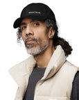 Unisex Classic baseball cap in black with embroidered WHATEVR logo, front view