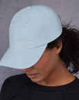 Unisex Classic baseball cap in light blue with embroidered WHATEVR logo, front view