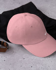 Unisex Classic baseball cap in pink with embroidered WHATEVR logo, front view