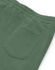 Men's essential relaxed sweatpants in green with embroidered detailing, back view.