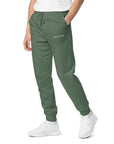 Men's essential relaxed sweatpants in green with embroidered detailing, front view.