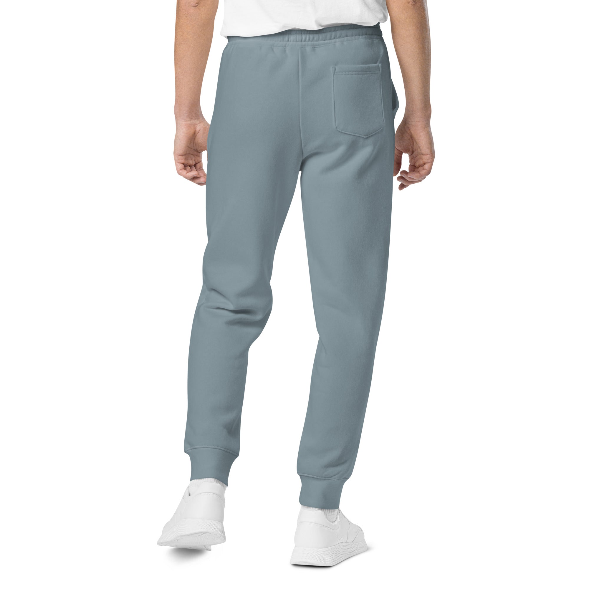 Men's essential relaxed sweatpants in blue, back view.