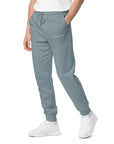 Men's essential relaxed sweatpants in blue with embroidered detailing, front view.