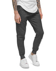 Men's essential slim fit sweatpants in graphite, front view.