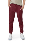 Men's essential slim fit sweatpants in maroon, front view.