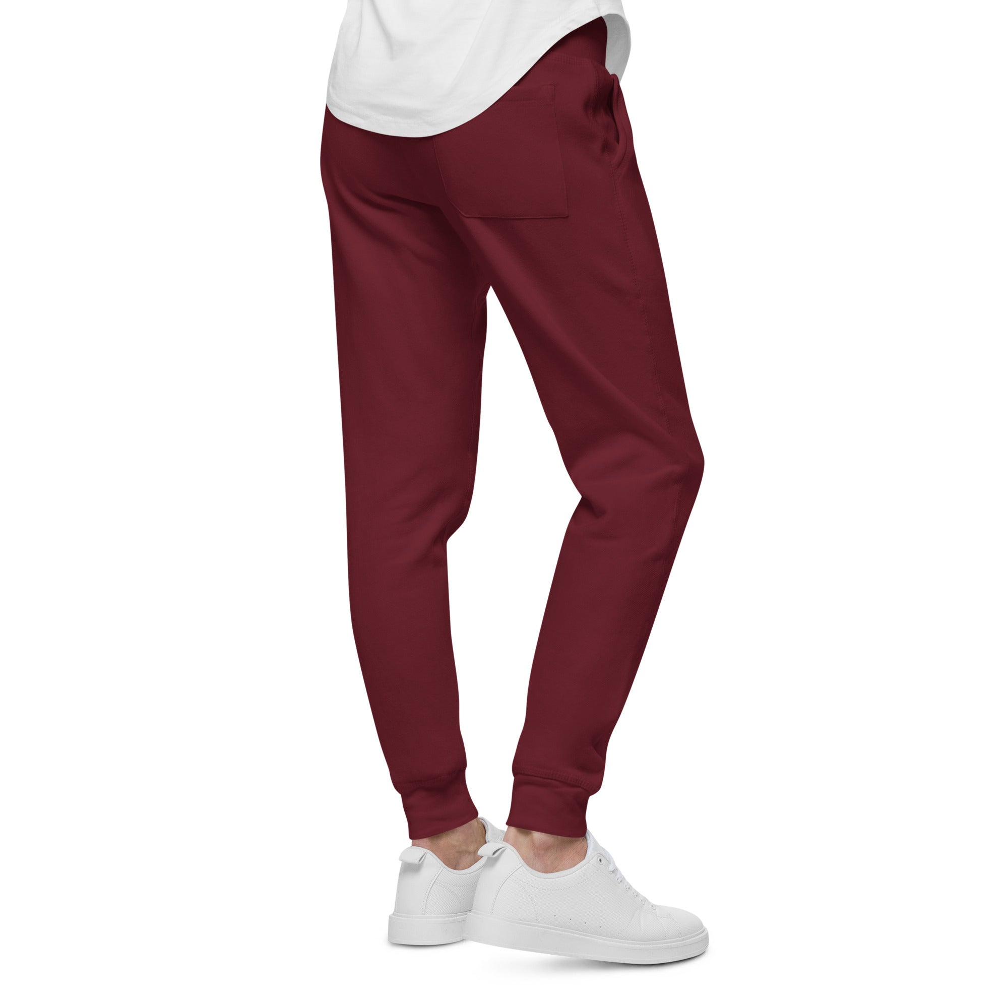 Men's essential slim fit sweatpants in maroon, side view.