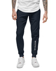 Men's essential slim fit sweatpants in blue, front view.
