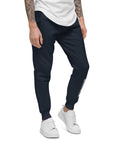 Men's essential slim fit sweatpants in blue, front view.
