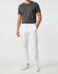 Men's essential slim fit sweatpants in white, front view.