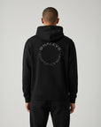 Men's premium heavyweight hoodie in black with "Confidence Worn" text, back view.