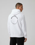 Men's premium heavyweight hoodie in white with "Confidence Worn" text, back view.