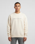 Men's premium crewneck sweatshirt in beige with embroidered detailing, front view